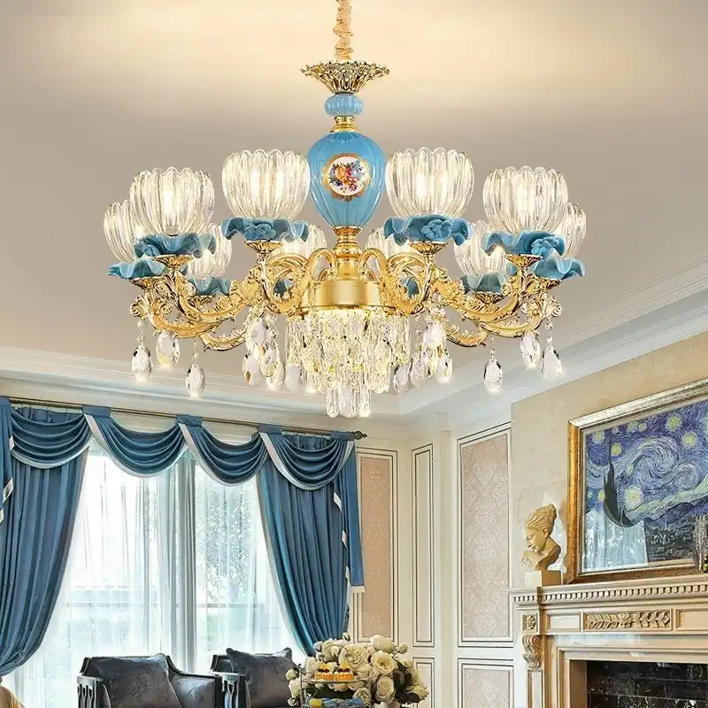 A Baroque-style chandelier with blue and gold accents, crystal details, hanging in a refined living room with blue curtains and classic decor